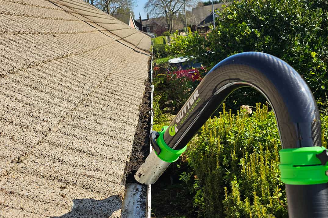 Gutter Cleaning with machine Photo